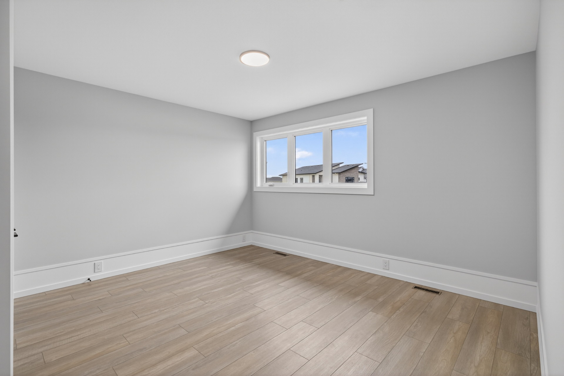 Upper Bedroom — A bright south-facing bedroom · 13.4 × 11.3