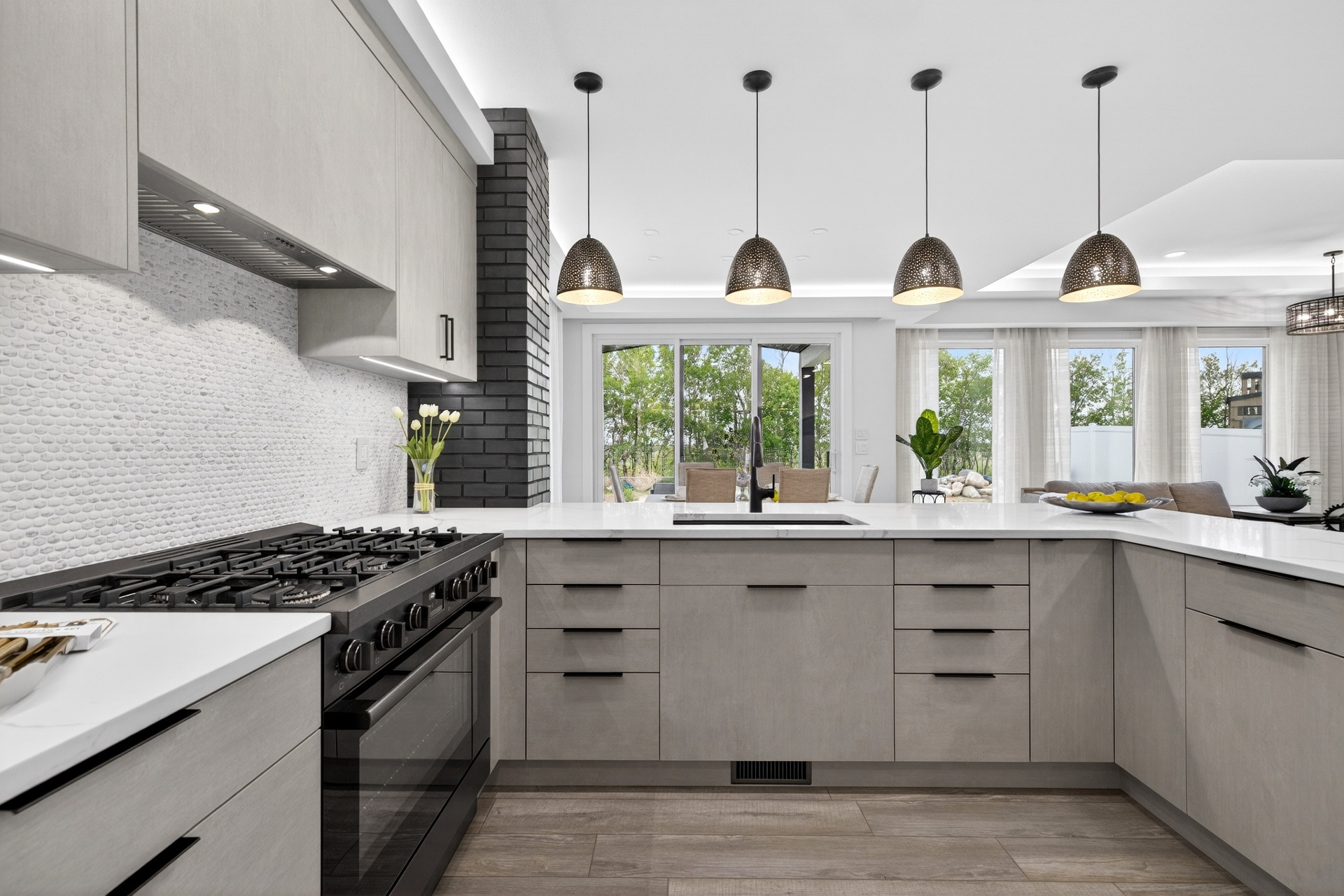 Open kitchen, dining and family living space with prairie views and a 10-foot living room ceiling